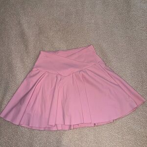 Pink women’s tennis skirt with crossover waist